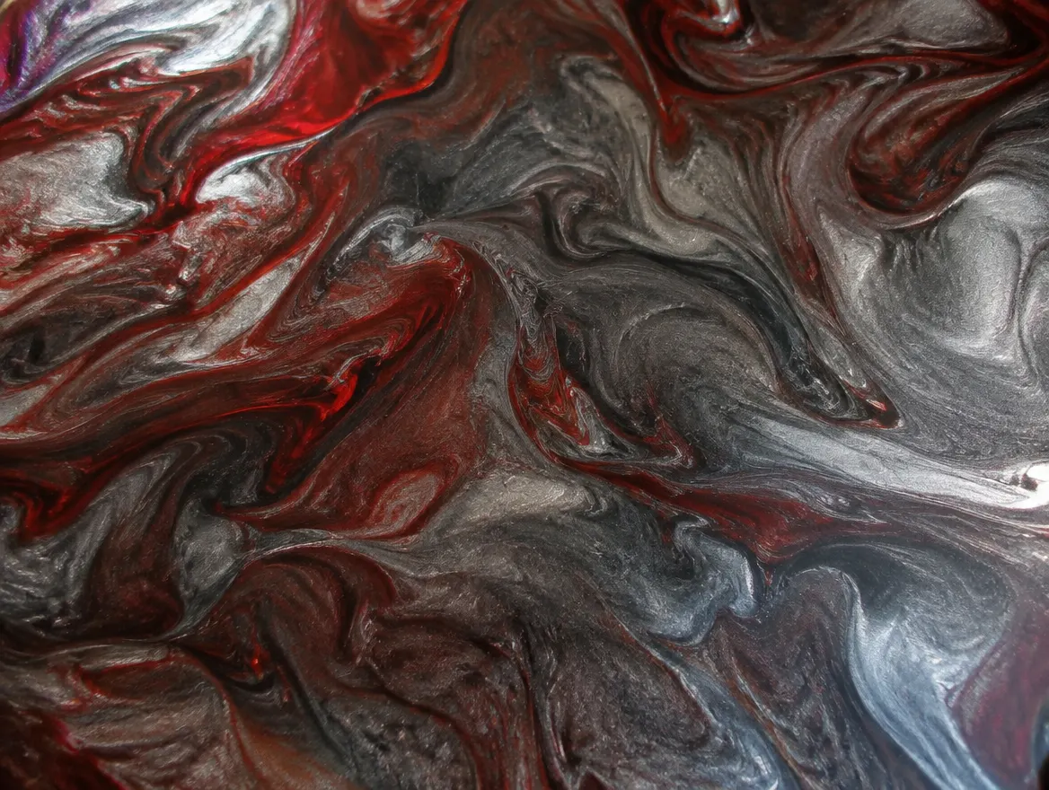 Marbled metallic epoxy floor sample with graphite, silver and red tones and a mirror gloss